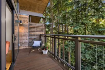 There is a beautiful outlook to the trees from the Great Room and deck.