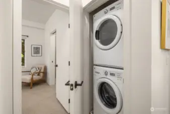 A stackable washer & dryer is located in the hall closet.
