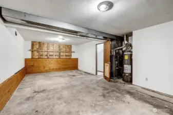 Large Family Room, looking east toward street. Gas furnace and Gas Water Heater here.