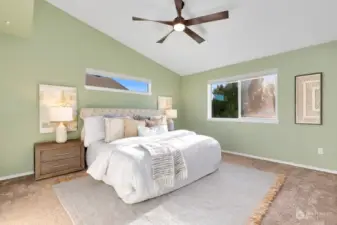 Primary room with vaulted ceilings & tons of natural light