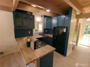 Kitchen leads to Sweet Back Yard