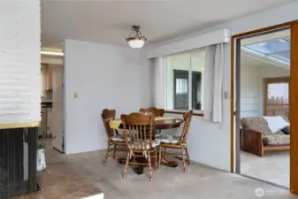 dining room, sun room and corner of the gas fireplace