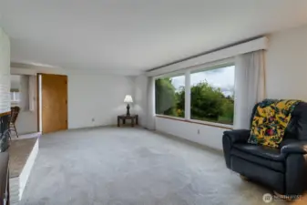 spacious living room, on nice days, you can see Mt. Baker, and on rainy days, you can light the gas fireplace.