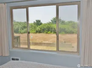 View from the Bedroom ~ looking West towards the backyard and Dunes Area behind the Property.