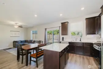Open-concept kitchen and dining area with ample natural light.