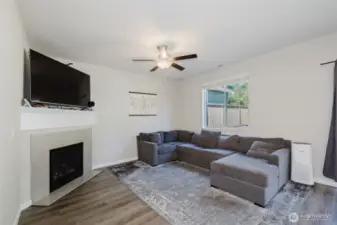 Living room with fireplace and built-in TV space.