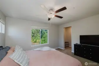 Primary suite with plenty of space for a king-sized bed.