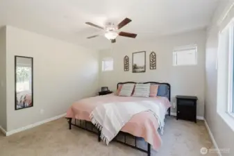 Primary bedroom with walk-in closet access.