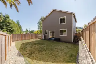 Rear exterior view with lawn space.