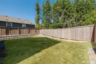 Fenced backyard offering privacy and room to relax.