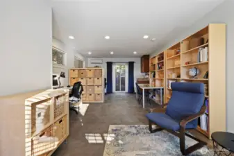 The attached studio was designed as a home office; it is very flexible space and includes the slider to backyard, seen ahead.  The ductless heat pump keeps it warm in winter and cool in summer!