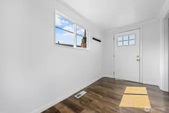 A large and welcoming entry offers ample room for greeting guests and creating a warm first impression.