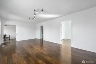 The original front door adds a touch of 1920’s character while opening into a wide, light-filled living room.