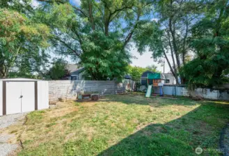 Fenced yard with space for pets, play, or gardening.