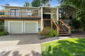 This beautiful Cambridge Split-Level is a stunner from the time you ascend up the front stairs!  This home stands apart from your traditional Split levels, with the different achitechural details such as the wrap-around porch and peaked ceiling with floor to ceiling windows.