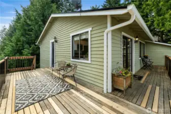 The deck area off of the kitchen- A great place to entertain and enjoy a summer BBQ or meal