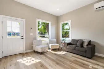 Quaint living area as you enter the home