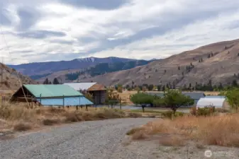View of the property, looking down the driveway from the highway.