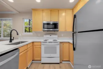 Kitchen with new quartz countertops and new faucet.