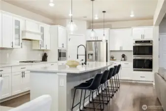 Dining space with large windows allowing natural light to fill the home, located within this Covington WA home for sale near shopping and commuter routes.