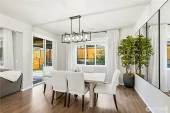 Dining area with open flow into the kitchen and living room, highlighting the spacious layout of this Covington Washington home for sale.