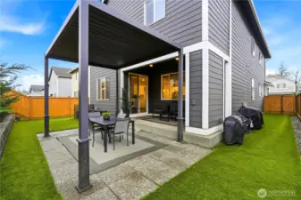 Fully fenced backyard with patio and low maintenance turf offering private outdoor living in this Covington Washington home for sale.
