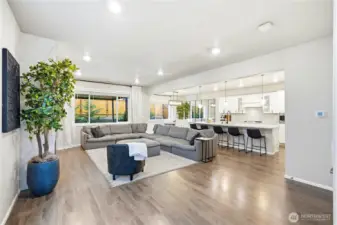 Main entertaining space and fireplace, perfect for gatherings at this Covington WA home for sale in a desirable community.