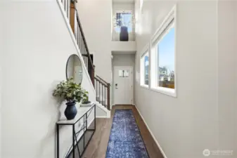 View of the entryway  and usable indoor space in  this modern Covington WA home for sale built in 2020.
