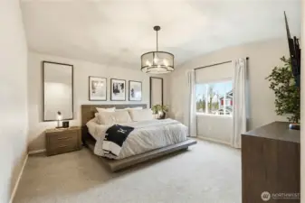 Primary bedroom retreat with vaulted ceilings and natural light inside this Covington Washington home for sale.