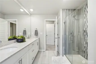 Primary bathroom featuring dual vanity and modern finishes in this Covington WA home for sale near parks, trails, and shopping.