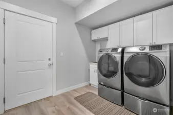 The door from the laundry room leads to the garage.  Washer and Dryer stay with home.