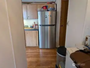 entry to kitchen, refrigerator included