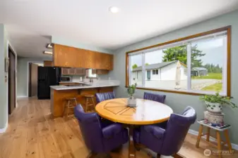 Kitchen with so much storage, quartz countertops, two pantries, breakfast bar and open to eating area so you can converse with family and guest while cooking up a great meal.