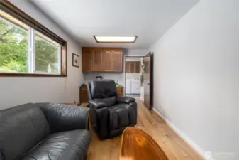 Office with built-in desk and large window to enjoy view of the back yard.