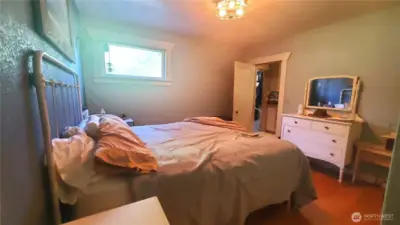 primary bedroom (through the kitchen on the right)