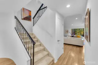 Stairs to the 2nd level and walkway to the living room.