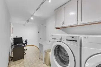 Laundry room is large and also used for an office/painting studio
