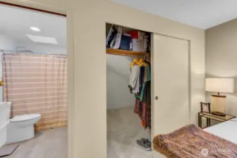 Full bath with closet view - note the large storage area