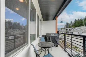 Balcony is off the Great room.  There is a duplicate of this deck above, just off the Primary suite.