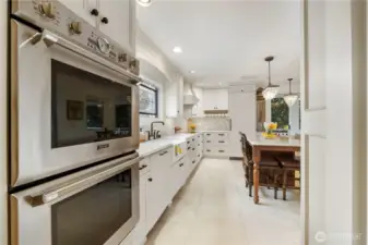 Bake pizza and cookies at the same time for your next party and there is a beverage/wine storage rack as well