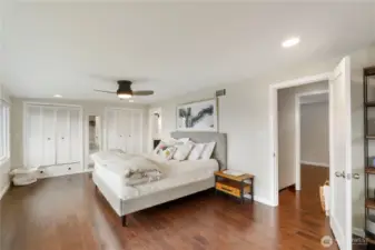 The primary suite offers built-in, cedar lined double closets and the door to the right leads to the 4th bedroom or perfectly placed office/den