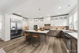 A kitchen fit for a chef! JennAir appliances, quartz counters, beverage fridge, double ovens, gas range, pantry, and fridge included!