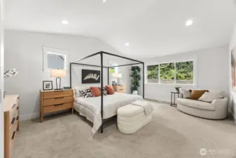 Huge primary suite with vaulted ceilings. Private outlook from windows