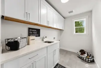 Laundry room with plenty of storage.