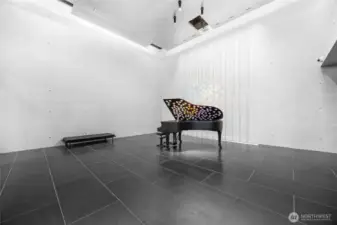 Step into a meticulously designed space, where a custom Fazioli piano catches the light in a dazzling display. The concierge greets you warmly, handing over your parcels from the secure mail storage, ensuring a seamless arrival home.