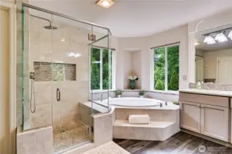Beautifully tiled shower, new flooring, soaker tub and tons of counter space