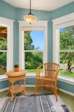 Coffee nook surrounded by windows on three sides.