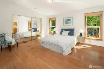 Primary bedroom is generous, with room for a private sitting area or workspace.