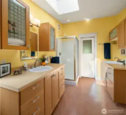 Primary 3/4 bath is generous and cheery.
