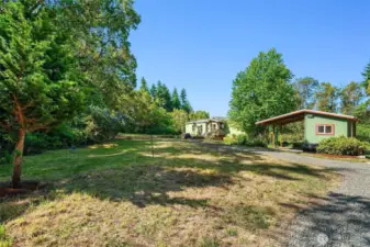 This property offers so much; lots of sunny level area for gardening or lawn games plus a big forested section for walks in the Madrona tree forest.